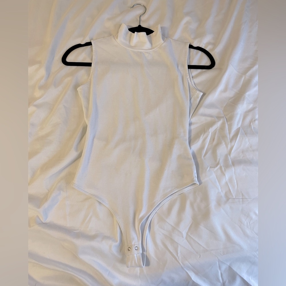 White turtle neck sleeveless bodysuit